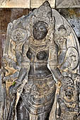 Prambanan - Durga Mahisasuramardini (slayer of the bull demon), in north chamber of Shiva Temple. She is said to be the princess Loro Djonggrang, who was cursed by her deceived lover, prince Bandung, and turned into stone. 